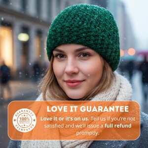 May include: A woman wearing a dark green knitted beanie and a cream scarf. The image includes the text "LOVE IT GUARANTEE" and a guarantee seal. The background shows a snowy outdoor scene.