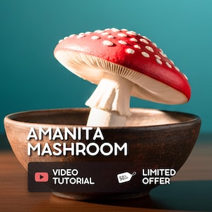 May include: A ceramic Amanita mushroom sculpture with a red cap and white spots sits in a brown bowl. The text "AMANITA MASHROOM" is above a black rectangle with "VIDEO TUTORIAL" and "LIMITED OFFER" text.