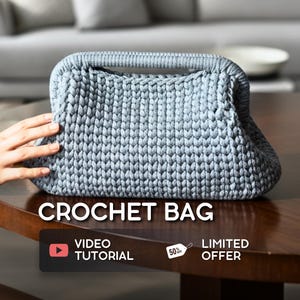 May include: A light blue crochet bag with a handle, sitting on a wooden table. The bag has a textured, woven appearance. The text "CROCHET BAG" is displayed on the image, along with a "VIDEO TUTORIAL" and "LIMITED OFFER" label.