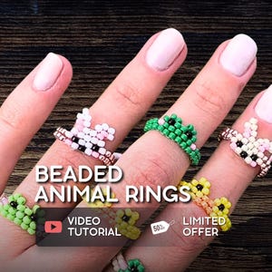 May include: A hand showcases multiple beaded animal rings in shades of green, yellow, pink, and white. The rings are designed to resemble animals. The image includes the text "Beaded Animal Rings", "Video Tutorial", and "Limited Offer".