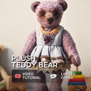 May include: A plush teddy bear with a lavender body, brown accents, and a gray dress with a decorative collar. The image includes text that reads "PLUSH TEDDY BEAR", "VIDEO TUTORIAL", and "LIMITED OFFER".