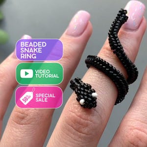 May include: A beaded snake ring in black, coiled around a finger. The snake's head features white bead eyes. The image includes text that reads "Beaded Snake Ring", "Video Tutorial", and "Special Sale 50% Off".