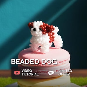 May include: A beaded dog ornament in white and red, sitting on a pink and yellow macaron. The image features the text "BEADED DOG", "VIDEO TUTORIAL", and "LIMITED OFFER".