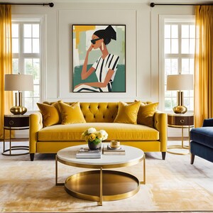 May include: A yellow velvet tufted sofa with a white marble and gold coffee table in a living room with a large abstract painting of a woman wearing sunglasses and a striped shirt.