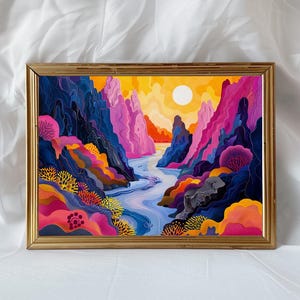 May include: A framed abstract painting depicting a colorful landscape with a river flowing through a canyon. The painting features vibrant hues of pink, blue, yellow, and orange, creating a dynamic and energetic composition.