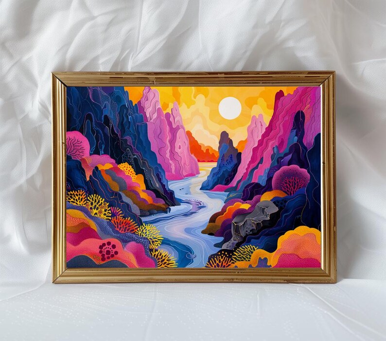May include: A framed abstract painting depicting a colorful landscape with a river flowing through a canyon. The painting features vibrant hues of pink, blue, yellow, and orange, creating a dynamic and energetic composition.