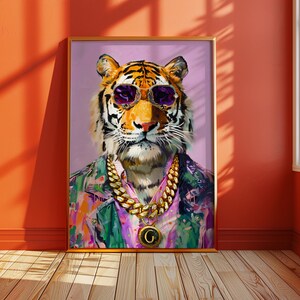 May include: A framed art print depicting a tiger wearing purple sunglasses, a gold chain necklace with a pendant, and a colourful shirt. The tiger's portrait is set against a light purple background.