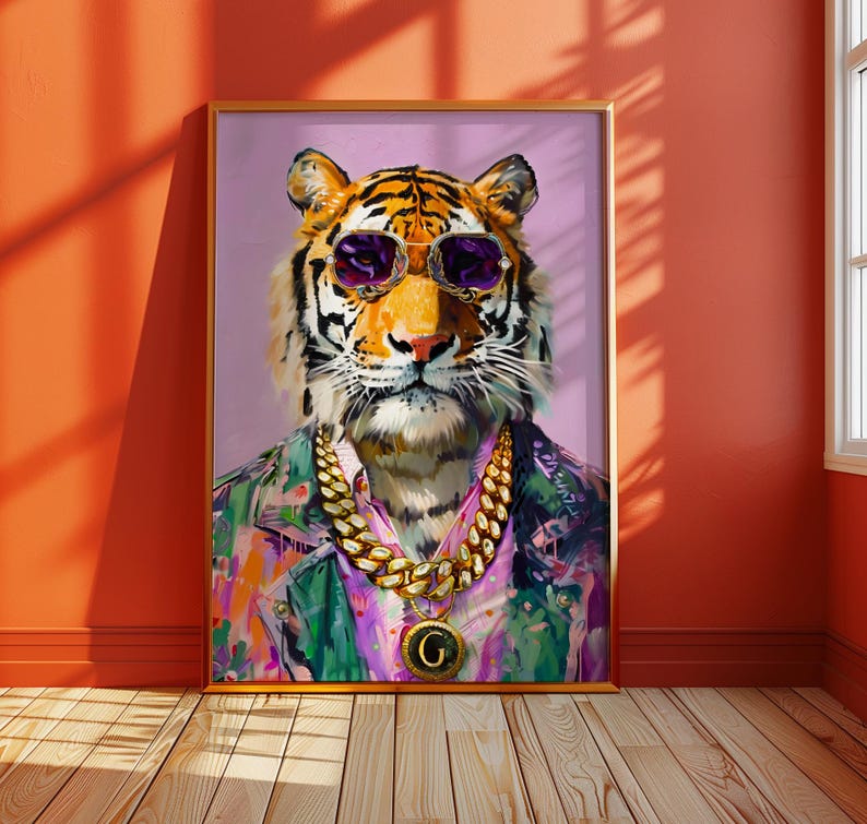 May include: A framed art print depicting a tiger wearing purple sunglasses, a gold chain necklace with a pendant, and a colourful shirt. The tiger's portrait is set against a light purple background.
