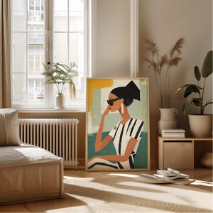 May include: A colorful abstract painting of a woman wearing sunglasses and a striped shirt. The background is a mix of yellow, green, and blue.