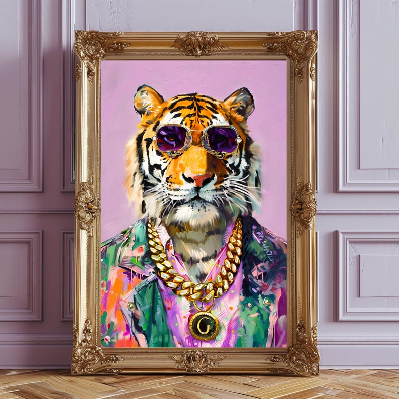 May include: A framed painting of a tiger wearing sunglasses, a gold chain, and a colourful jacket. The tiger is set against a pink background and framed in a gold ornate frame. The artwork is a portrait of a tiger.