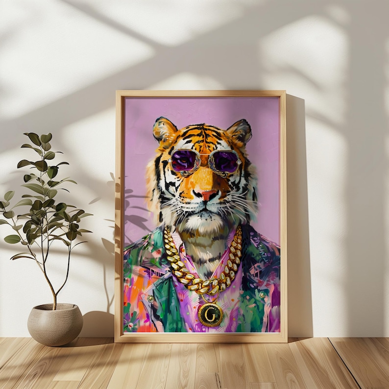 May include: Framed artwork of a tiger wearing purple sunglasses, a gold chain necklace with a pendant, and a colourful shirt. The tiger is set against a light purple background. The artwork is in a wooden frame.