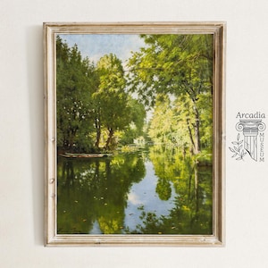 May include: A framed painting depicting a tranquil river scene with lush green trees and foliage. The river reflects the sky and trees, creating a serene atmosphere. The painting is signed "Hans Jessen" in the lower left corner.