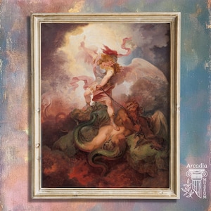 May include: A framed oil painting depicting a winged figure in armor standing over a dark, horned creature while holding a chain. The scene is set against a dramatic, cloudy sky with golden light and deep red shadows. The frame is light-colored wood.