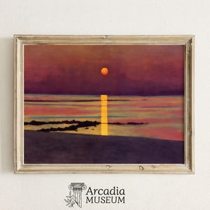May include: A framed painting depicting a sunset over a body of water. The sky is a deep purple with a bright orange sun setting in the distance. The water is a light blue with a golden reflection of the sun. The painting is framed in a light wood frame.