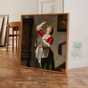 Puede incluir: Una impresi&oacute;n de pintura al &oacute;leo enmarcada que muestra a una persona con corpi&ntilde;o rojo y delantal blanco sosteniendo una bandeja con un vaso y una botella. La persona inclina la cabeza hacia atr&aacute;s para beber de un vaso. Marco de madera.