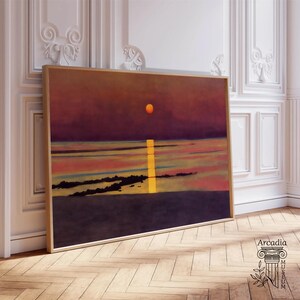 May include: A framed painting of a sunset over a body of water. The sky is a deep purple with a bright orange sun in the center. The water is a light blue with a yellow line of light reflecting off the sun. The painting is framed in a simple wooden frame.