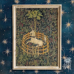 May include: A framed wall art print featuring a white unicorn resting inside a circular wooden fence, set against a dark, dense background of colorful flowers and foliage. The artwork is enclosed in a light-colored wooden frame.