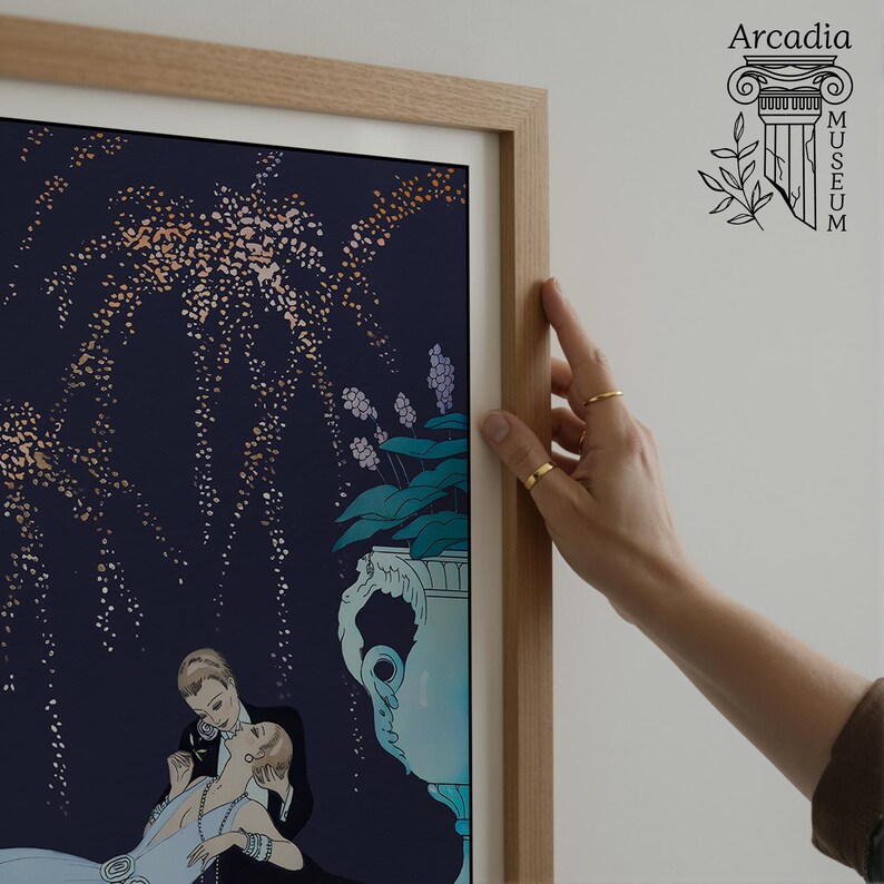 May include: A framed art print featuring a dark blue background with gold speckled fireworks, a light blue decorative urn with flowers, and a couple in formal attire. The print is encased in a light wood frame with a white mat border.