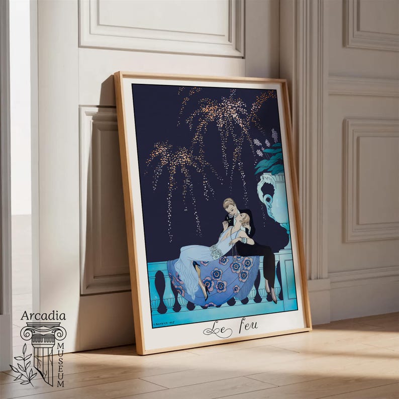 May include: A framed art print titled Le feu featuring a dark blue night sky with gold fireworks above a couple sitting on a balcony. The person in the foreground wears a light blue dress with floral patterns, while the other wears a black suit.