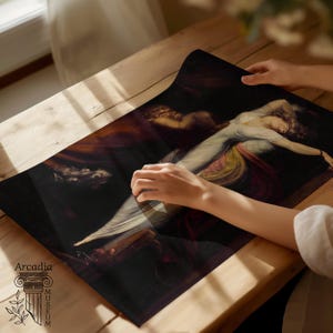 May include: A rectangular print featuring a reproduction of a dark, dramatic oil painting depicting a figure in a white garment reclining against a shadowy background. The print includes the text Arcadia Museum with a column icon in the corner.