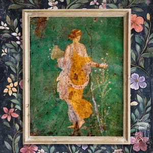 May include: A framed wall art print featuring a classical Roman-style fresco of a figure in a yellow draped garment against a vibrant green background. The figure holds a cornucopia and stands amidst stylized flowers. The text Arcadia is visible.