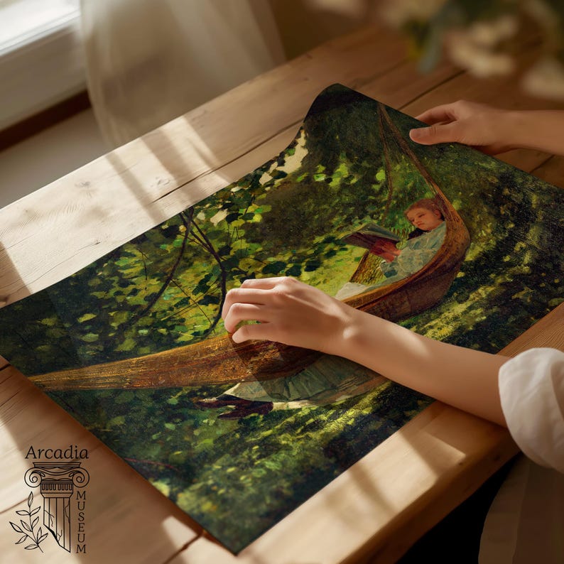 May include: A rectangular art print featuring a painting of a person reading in a hammock suspended among lush green trees. The print displays deep forest tones and dappled sunlight. The text Arcadia Museum is printed in the bottom left corner.