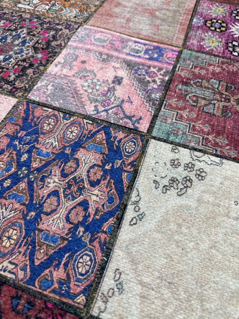 May include: A patchwork rug with a variety of colors and patterns, including pink, blue, red, and green. The rug is made of different pieces of fabric sewn together.