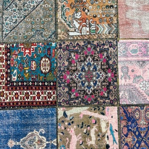 May include: A patchwork rug with different colored squares featuring intricate floral and geometric patterns. The rug is made of wool and has a vintage look.
