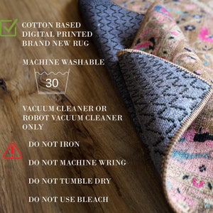 May include: A close-up of a rug's care instructions. The instructions state that the rug is cotton based, digitally printed, and machine washable. The rug should be cleaned with a vacuum cleaner or robot vacuum cleaner. The instructions also state that the rug should not be ironed, machine wrung, tumble dried, or bleached.