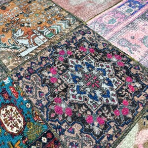 May include: A patchwork rug with a variety of colorful patterns and designs. The rug is made up of different pieces of fabric sewn together, creating a unique and eclectic look. The rug features a central medallion with a floral design, surrounded by geometric patterns and borders.