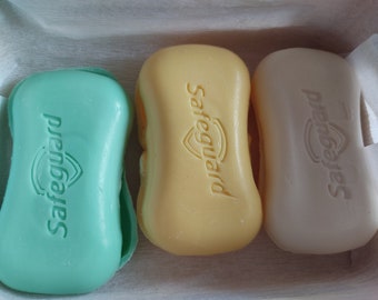 May include: Three bars of Safeguard soap, one green, one yellow, and one white.