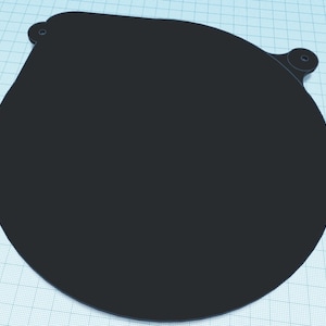 May include: A black, round, flat, metal disc with two small holes on the top edge.