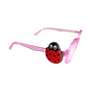 May include: Pink glittery glasses featuring a ladybug embellishment on the side. The ladybug is red with black spots and a black head with white eyes. The frames are translucent pink with a subtle glitter finish throughout the material.