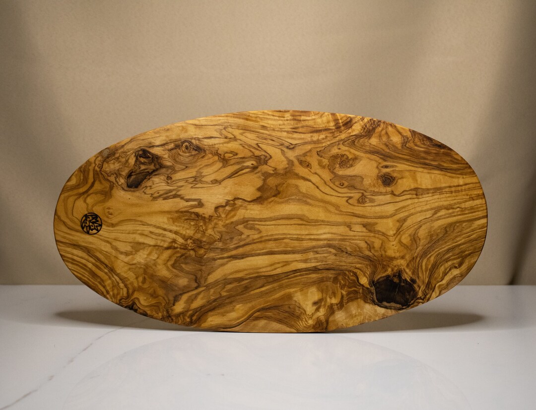 Planche a découper ronde en bois d'olivier
