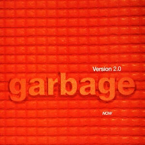 May include: An orange background with a textured pattern. The word "garbage" is in large, 3D-style orange letters. Above the word is "Version 2.0" and below it is "NOW". The website address is at the bottom.