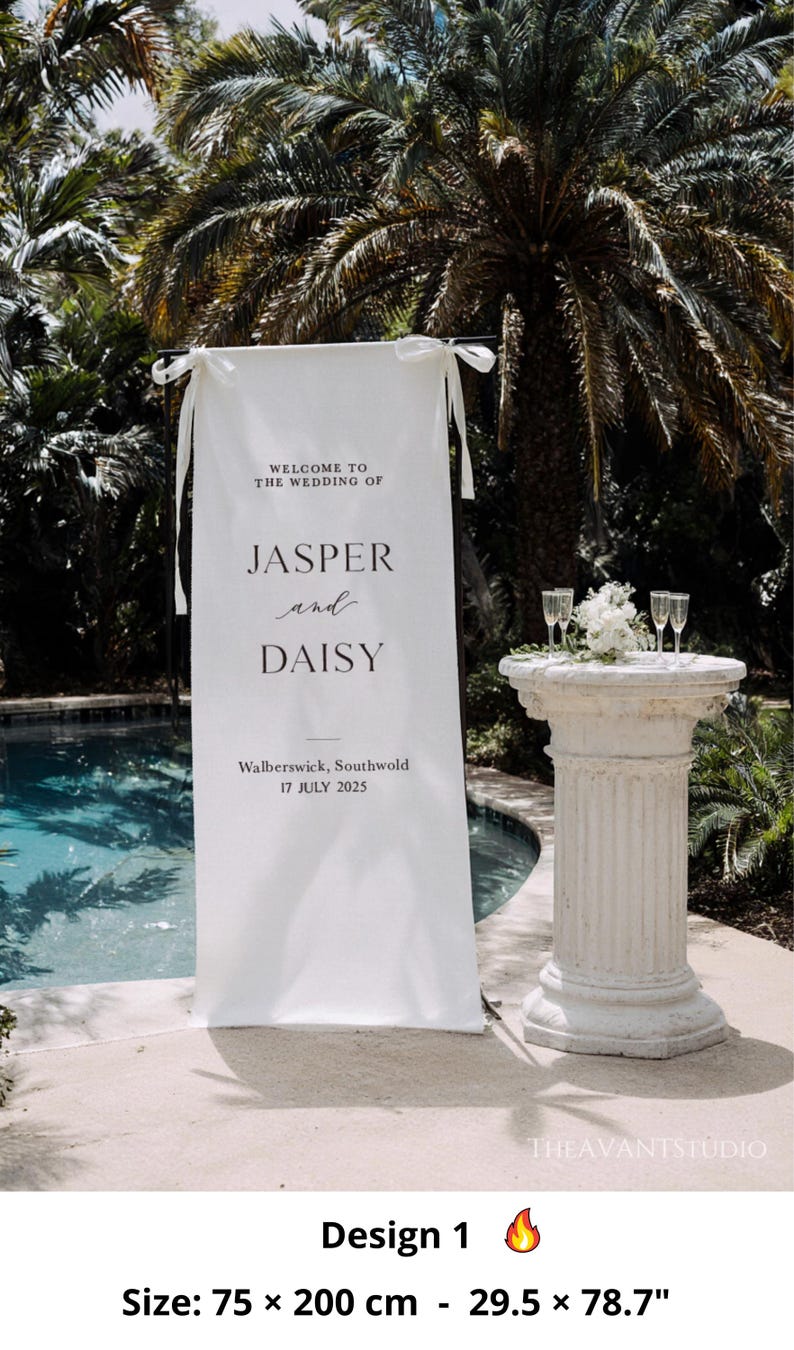 May include: A white wedding banner with the text "WELCOME TO THE WEDDING OF JASPER and DAISY" and the date "17 JULY 2025". The banner is 29.5 x 78.7 inches. A decorative pillar holds champagne glasses and flowers.