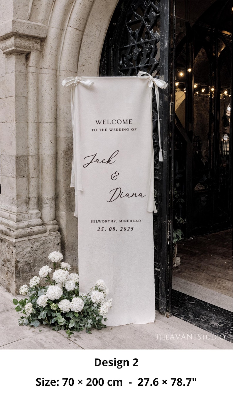 May include: A cream-colored wedding banner with the text "WELCOME TO THE WEDDING OF Jack & Diana" and the date 25.08.2025. The banner is 27.6 x 78.7 inches and is tied with white ribbons. White flowers are at the base.