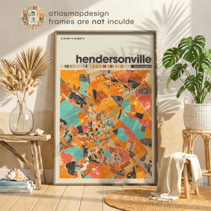 May include: A vertical wall art print featuring a stylized map of Hendersonville, North Carolina. The map displays a grid of streets and areas in shades of orange, teal, and gray, with the text Hendersonville and North Carolina at the top.
