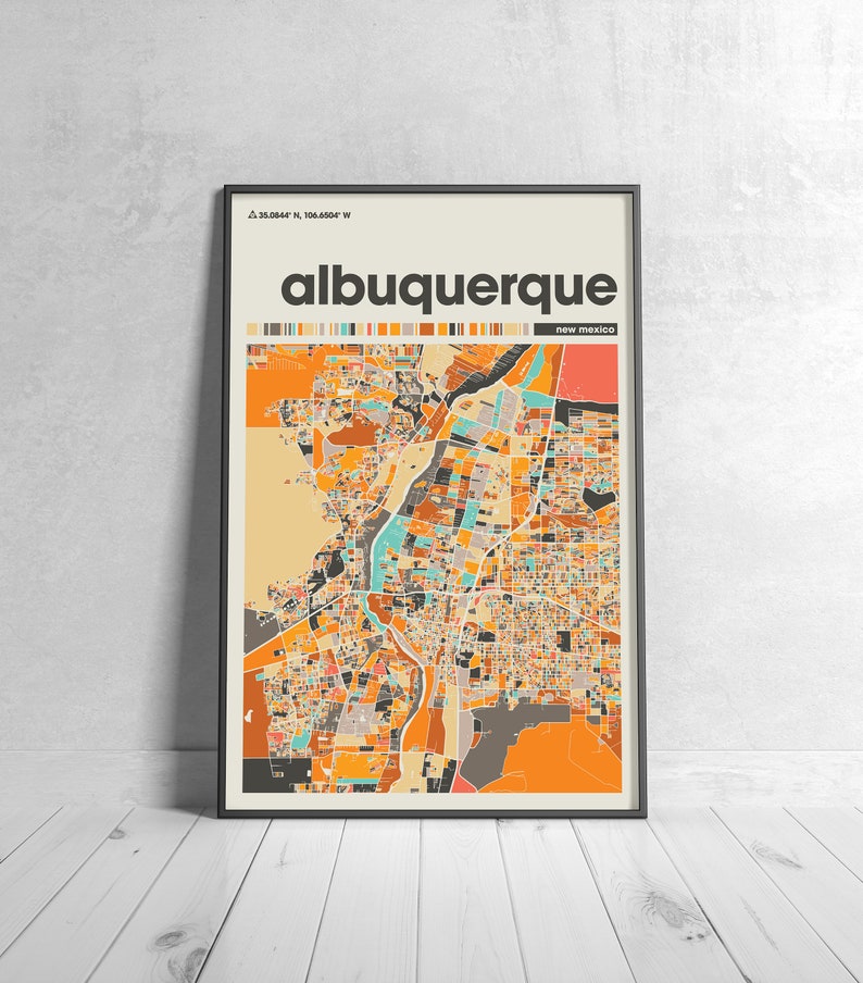 May include: A colorful map of Albuquerque, New Mexico, with the city name and state printed in black text at the top. The map is framed in a black frame.