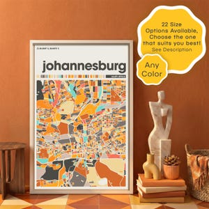 May include: A framed art print of Johannesburg, South Africa, featuring a colorful abstract map design. The print includes the city name and coordinates, with text stating "22 Size Options Available, Choose the one that suits you best! See Description" and "Any Color."
