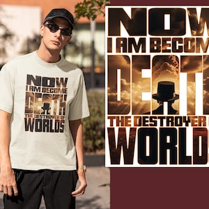 May include: A white t-shirt with a graphic print of a person in a hat with the text "NOW I AM BECOME DEATH THE DESTROYER OF WORLDS".