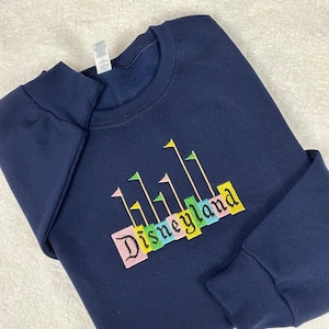 Disneyland Spell Out Sign With Flags Embroidered Crewneck Sweatshirt, Vintage Disney Vacation Adult, Youth, Toddler Sweatshirt