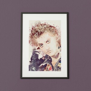 May include: A watercolor painting of a person with short, curly hair wearing a black leather jacket. The painting is framed in a black frame.