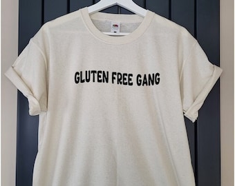 May include: A white t-shirt with the text "Gluten Free Gang" printed in black.