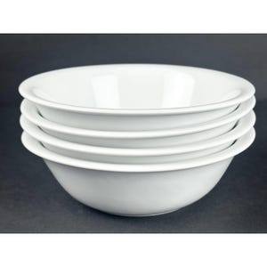 May include: A stack of four plain white ceramic bowls with smooth, rounded edges and a glossy finish. The bowls are uniform in size and shape, featuring a deep basin and a wide rim, creating a clean and simple look for serving various food items.