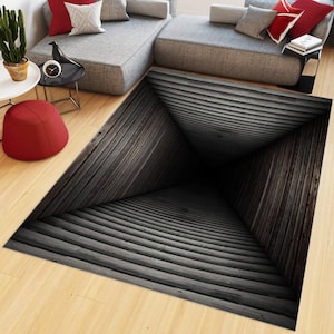 May include: A rectangular area rug featuring a 3D optical illusion print of a dark gray wooden tunnel that appears to recede into a deep, black central point. The design consists of horizontal wooden planks that create a sense of depth.