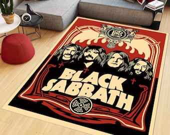 May include: A rectangular area rug featuring a graphic illustration of the band Black Sabbath. The design includes four figures with long hair, the text Black Sabbath in large cream letters, and red, black, and cream decorative border elements.