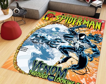 May include: A comic book rug featuring a black and green Venom character with the text "The Amazing Spider-Man" and "Venom Through the Looking Glass!"