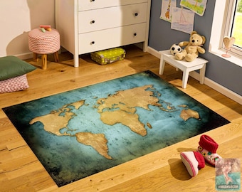 May include: A rectangular area rug featuring a world map design with gold-toned continents set against a textured, deep teal and blue ocean background. The map displays the global landmasses in a vintage-inspired, weathered aesthetic.
