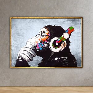 May include: A colorful painting of a monkey wearing headphones. The monkey is looking to the side and has a thoughtful expression. The background is a light gray with a textured look.